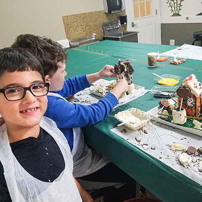 two boys making candy in the Morkes halloween Candy Camp