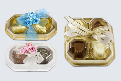 chocolate hearts and truffles in domed box wedding favor view image