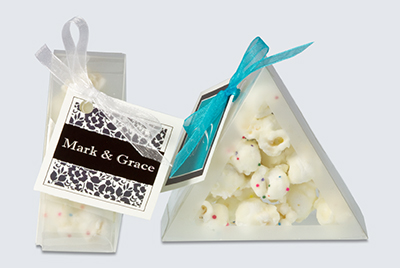 triangle box wedding favor filled with chocolate covered popcorn